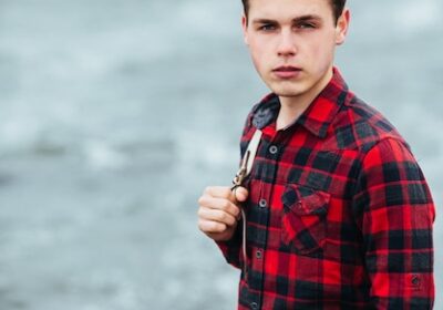 serene-boy-posing-with-plaid-shirt_1153-822